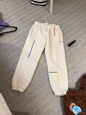 Madhappy Cream Sweatpants with Rainbow Stitch Accents